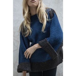 This is a Nymane Together Sweater in navy and charcoal oversized flare sleeves